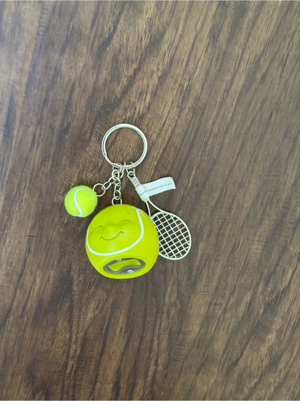 Urban outfitters Tennis Ball & Racket Keychain - Neon Yellow